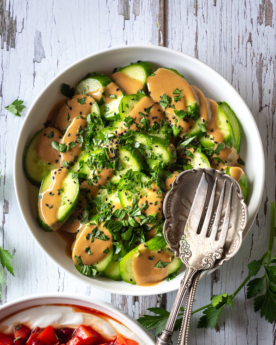 https://primalwellness.coach/wp-content/uploads/2022/08/Tomato-Salad-with-Pomegranate-and-Mint-and-Cucumber-Salad-with-Tahini-Dressing-1.jpg